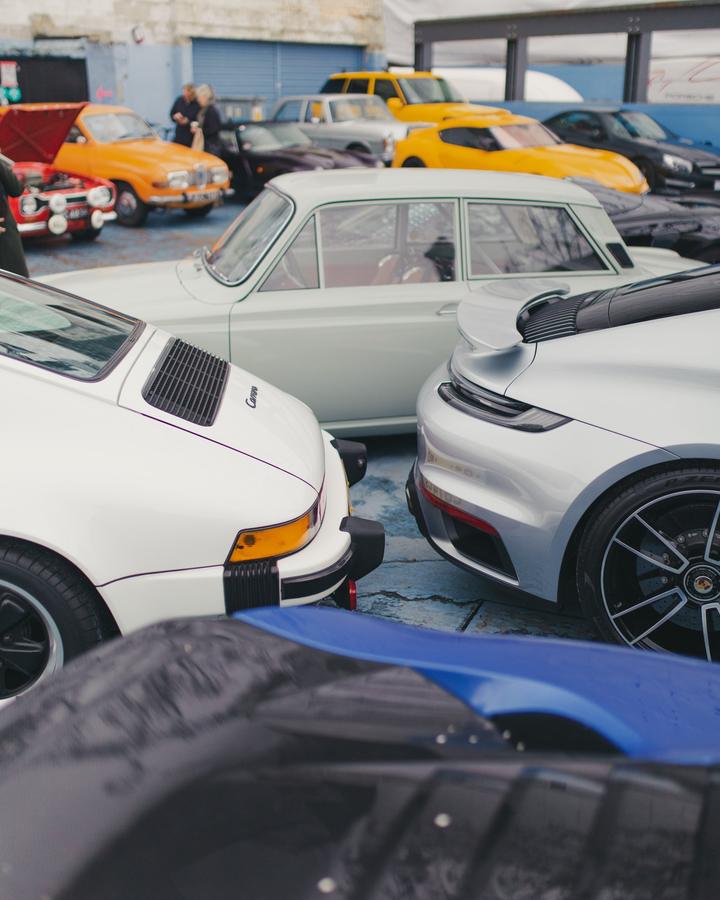 Porsche 911 Carrera next to a modern 911 Turbo
