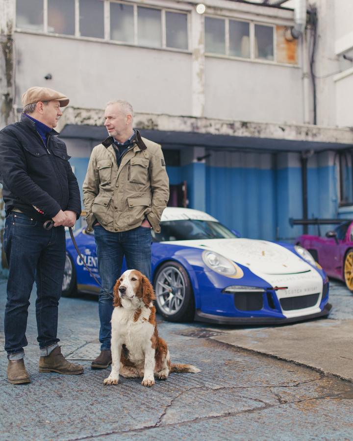 Owners chatting by the Glenturret Porsche, with a spaniel keeping watch