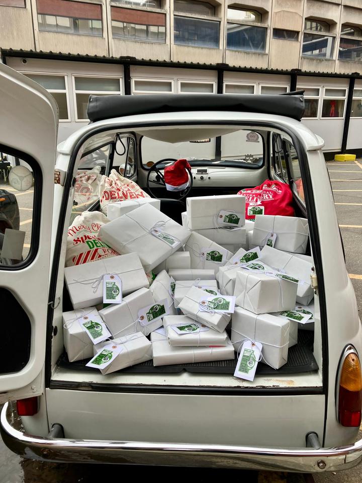 The Fiat's boot full of wrapped presents with Fund of Cars tags